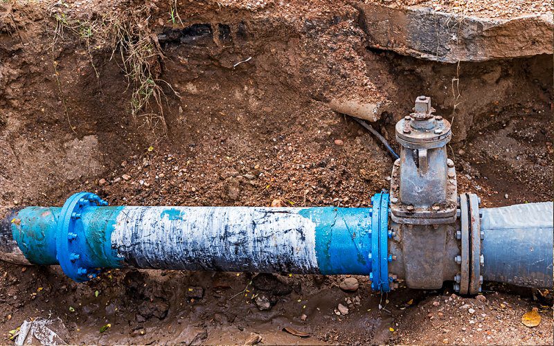 digging trench sewer line Septic to Sewerage Conversions